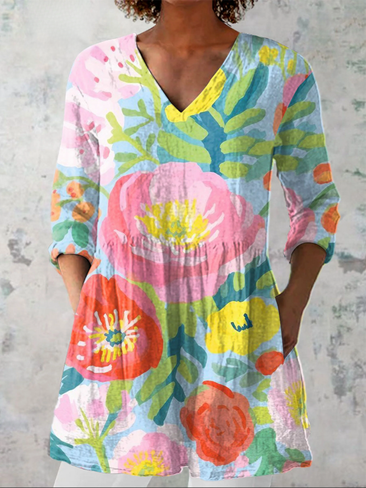 Blusa lunga con scollo a V