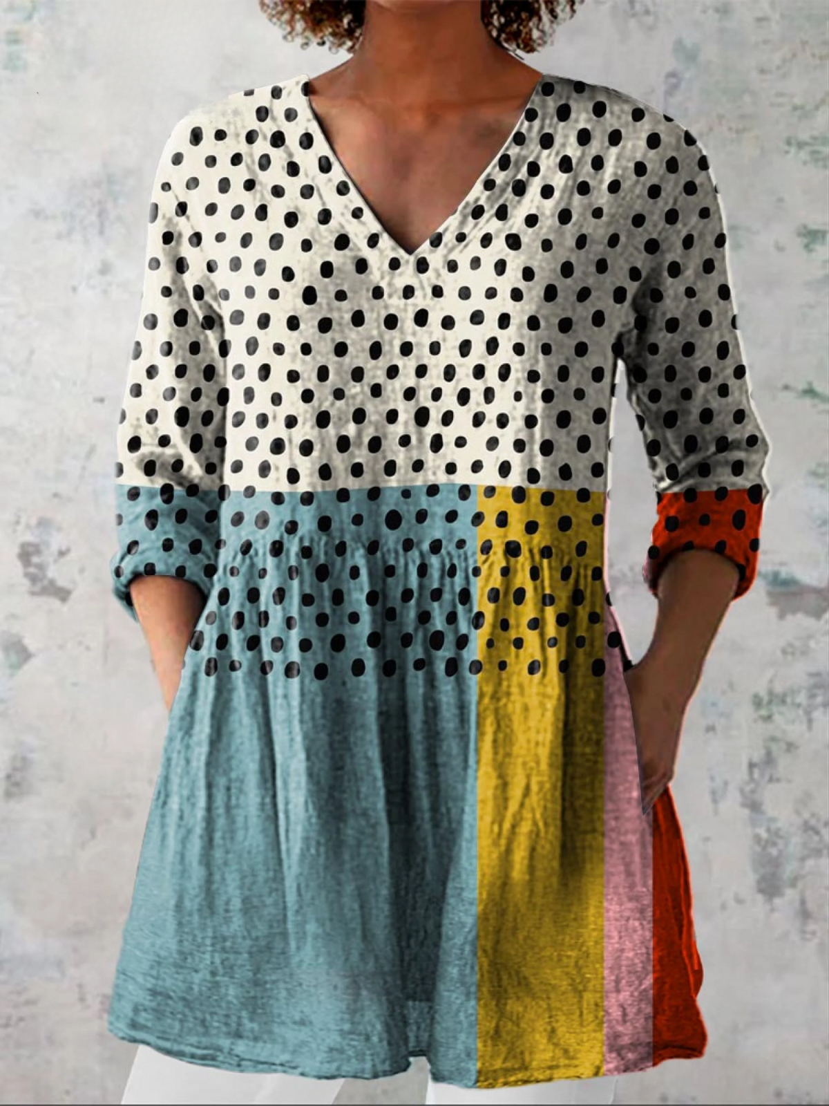 Blusa lunga con scollo a V