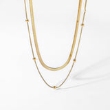 Claire – Una collana semplice in oro a due fili dal fascino moderno